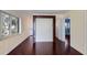 Living room showcasing wood floors, bright walls, and views into the kitchen at 2310 Gulf N Dr # 201, Bradenton Beach, FL 34217