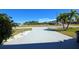 Long driveway with palm trees and landscaping at 2701 Larkspur Dr, Punta Gorda, FL 33950