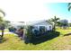 Another side view of the house, highlighting the landscaping and architecture at 2701 Larkspur Dr, Punta Gorda, FL 33950