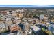 Expansive aerial view of the cityscape with buildings, lush greenery, and a clear blue sky at 300 S Pineapple Ave # 802, Sarasota, FL 34236