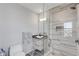 Modern bathroom with stone tiled shower and floating vanity with vessel sink at 300 S Pineapple Ave # 802, Sarasota, FL 34236