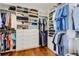 Organized walk-in closet with custom shelving, hanging racks and drawers for ample storage at 300 S Pineapple Ave # 802, Sarasota, FL 34236