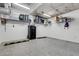 Clean garage with epoxy floor, safe, shelving and bumpers at 300 S Pineapple Ave # 802, Sarasota, FL 34236