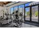 Bright gym featuring modern machines, natural light from large windows, and outside views at 300 S Pineapple Ave # 802, Sarasota, FL 34236