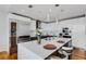 Modern kitchen featuring stainless steel appliances, an island with seating, and bright recessed lighting at 300 S Pineapple Ave # 802, Sarasota, FL 34236