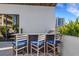 Community outdoor kitchen area featuring bar seating, granite countertops, and stainless steel grill at 300 S Pineapple Ave # 802, Sarasota, FL 34236