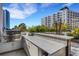 Community outdoor kitchen area featuring granite countertops, stainless steel grill, and bar seating at 300 S Pineapple Ave # 802, Sarasota, FL 34236