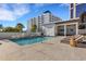 Stunning rooftop pool with lounge chairs and a shaded cabana for relaxation at 300 S Pineapple Ave # 802, Sarasota, FL 34236