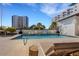 Resort-style rooftop pool surrounded by luxurious high-rise buildings at 300 S Pineapple Ave # 802, Sarasota, FL 34236