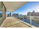 Private balcony boasts panoramic views of city buildings, waterways and clear blue sky at 301 Quay Commons # 1411, Sarasota, FL 34236