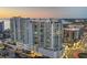 Exterior of high-rise condo with multiple stories of balconies offering a pool deck and amazing views at 301 Quay Commons # 1411, Sarasota, FL 34236