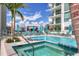 Relaxing rooftop spa and lounge area with city views at 301 Quay Commons # 1411, Sarasota, FL 34236