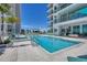 Stunning rooftop pool and spa featuring ample seating and shade at 301 Quay Commons # 1411, Sarasota, FL 34236