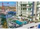 Aerial view of a rooftop pool and lounge area at 301 Quay Commons # 1411, Sarasota, FL 34236