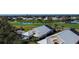 Aerial view of home overlooking a golf course and pond at 308 Bermuda Ct # 13, Venice, FL 34293