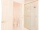 Bright bathroom with glass enclosed shower and a toilet at 308 Bermuda Ct # 13, Venice, FL 34293