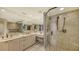 Bathroom with double vanity and a walk-in shower at 360 Gulf Of Mexico Dr # 332, Longboat Key, FL 34228