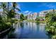 Reflective pool with condos and lush landscaping at 360 Gulf Of Mexico Dr # 332, Longboat Key, FL 34228