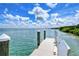 White wooden dock extending over calm water at 360 Gulf Of Mexico Dr # 332, Longboat Key, FL 34228