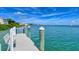 Private dock with bench overlooking calm water at 360 Gulf Of Mexico Dr # 332, Longboat Key, FL 34228