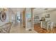 Elegant entryway with view of kitchen and living areas at 360 Gulf Of Mexico Dr # 332, Longboat Key, FL 34228