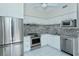 Modern kitchen with stainless steel appliances at 360 Gulf Of Mexico Dr # 332, Longboat Key, FL 34228