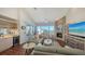 Spacious living area featuring a fireplace and stunning water views at 360 Gulf Of Mexico Dr # 332, Longboat Key, FL 34228