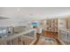 Bright loft overlooking the living area with hardwood floors at 360 Gulf Of Mexico Dr # 332, Longboat Key, FL 34228