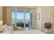 Main bedroom with balcony access and water views at 360 Gulf Of Mexico Dr # 332, Longboat Key, FL 34228