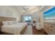 Spacious main bedroom with water views and a large TV at 360 Gulf Of Mexico Dr # 332, Longboat Key, FL 34228