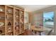 Home office with built-in shelving and a small table at 360 Gulf Of Mexico Dr # 332, Longboat Key, FL 34228