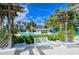 Resort-style pool with lounge chairs and lush landscaping at 360 Gulf Of Mexico Dr # 332, Longboat Key, FL 34228