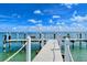 Fishing dock extending into the calm waters at 360 Gulf Of Mexico Dr # 332, Longboat Key, FL 34228