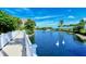 White wooden walkway with swans on the pond at 360 Gulf Of Mexico Dr # 332, Longboat Key, FL 34228