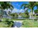 Landscaped walkway with fountain and tropical plants at 360 Gulf Of Mexico Dr # 332, Longboat Key, FL 34228