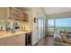 Wet bar with wine fridge and stunning water views at 360 Gulf Of Mexico Dr # 332, Longboat Key, FL 34228