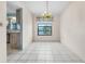 Dining room with tile floors and a chandelier light fixture at 3718 61St St, Bradenton, FL 34209