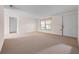 Living room featuring neutral walls with a sliding door at 3718 61St St, Bradenton, FL 34209