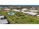 Community overview showcasing landscaping and pool at 3749 Amesbury Ln # 5608, Sarasota, FL 34232