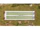 Aerial view of a shuffleboard court surrounded by green grass at 4126 Heron Way # B113, Bradenton, FL 34205