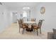 Dining room showcasing seating for four, with views of the kitchen and the front entrance at 4126 Heron Way # B113, Bradenton, FL 34205