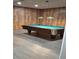 Basement recreation room featuring a pool table under pendant lighting, perfect for entertainment at 4160 Fruitville Rd # 32, Sarasota, FL 34232