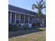 A screened-in back porch with a palm tree in the yard, providing a relaxing outdoor space at 4160 Fruitville Rd # 32, Sarasota, FL 34232