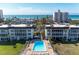 Aerial view of condo community with oceanfront pool at 4320 Falmouth Dr # 301, Longboat Key, FL 34228