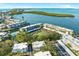 Aerial view of waterfront condo community with pool and parking at 4320 Falmouth Dr # 301, Longboat Key, FL 34228