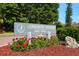 Longboat Harbour sign surrounded by landscaped flower beds and manicured grounds at 4320 Falmouth Dr # 301, Longboat Key, FL 34228