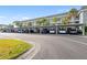 Condo building with covered parking and landscaping at 4320 Falmouth Dr # 301, Longboat Key, FL 34228