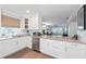 White kitchen with stainless steel appliances and granite countertops at 4320 Falmouth Dr # 301, Longboat Key, FL 34228