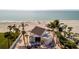 Beachfront gazebo, providing shade and a relaxing space at 4430 Exeter Dr # 104, Longboat Key, FL 34228