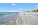 Beautiful beach view with white sand and ocean waves at 4430 Exeter Dr # 104, Longboat Key, FL 34228